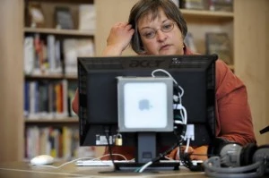 051210_unemploy_CFW- Nancy Karnes, uses a computer at the Anythink library in Thornton, CO. She says she has 5 different library cards and libraries are the only access she has to the internet. Today she checks a number of employment websites in her job s